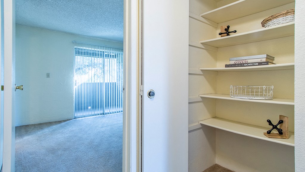 Cottonwood Creek apartment with cream colored linen closet.