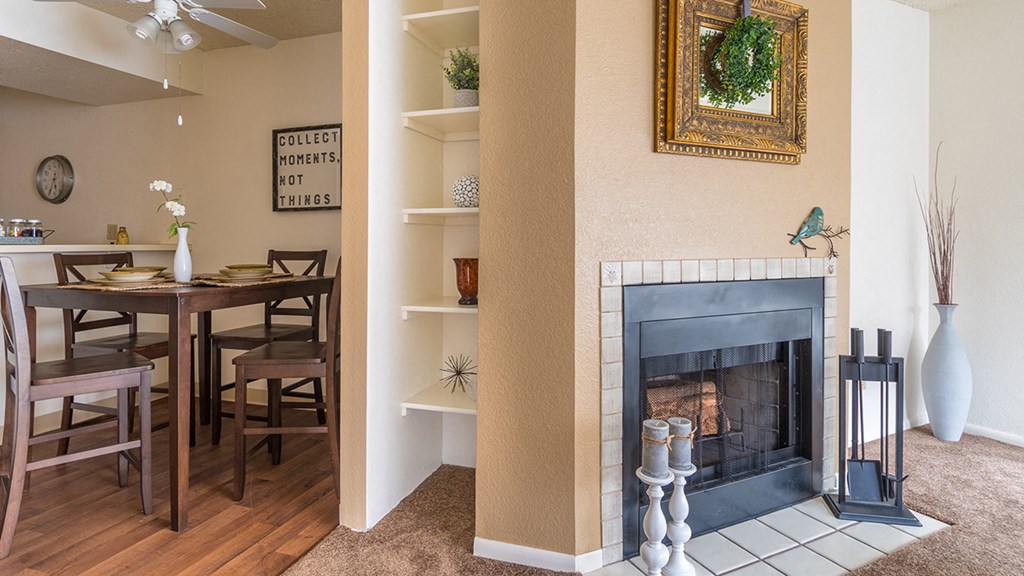 Ridgepointe living room with carpet flooring and nice cozy fireplace