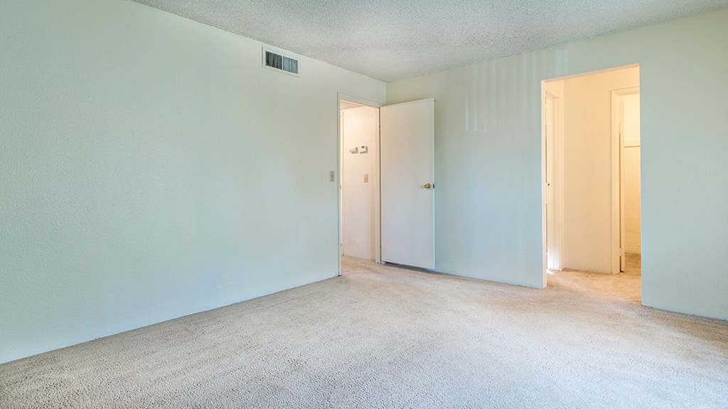 Cottonwood Creek master bedroom with carpet flooring.