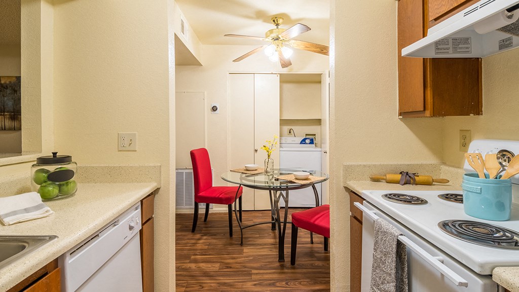 Enclave spacious kitchen with plenty of cabinetry, a fridge, a dishwasher, and a oven