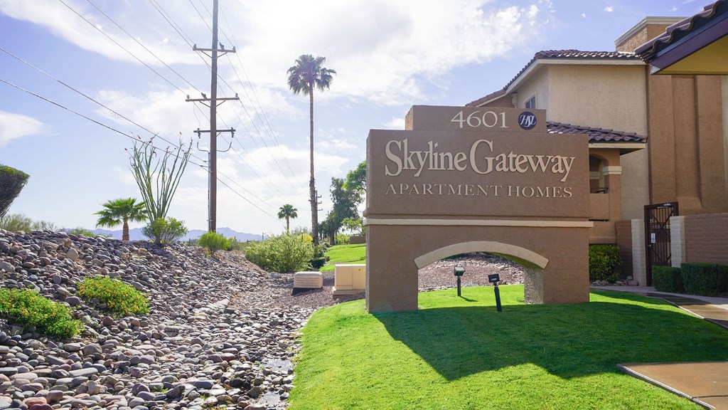 The image shows the entrance to the Skyline Gateway Apartment Homes.