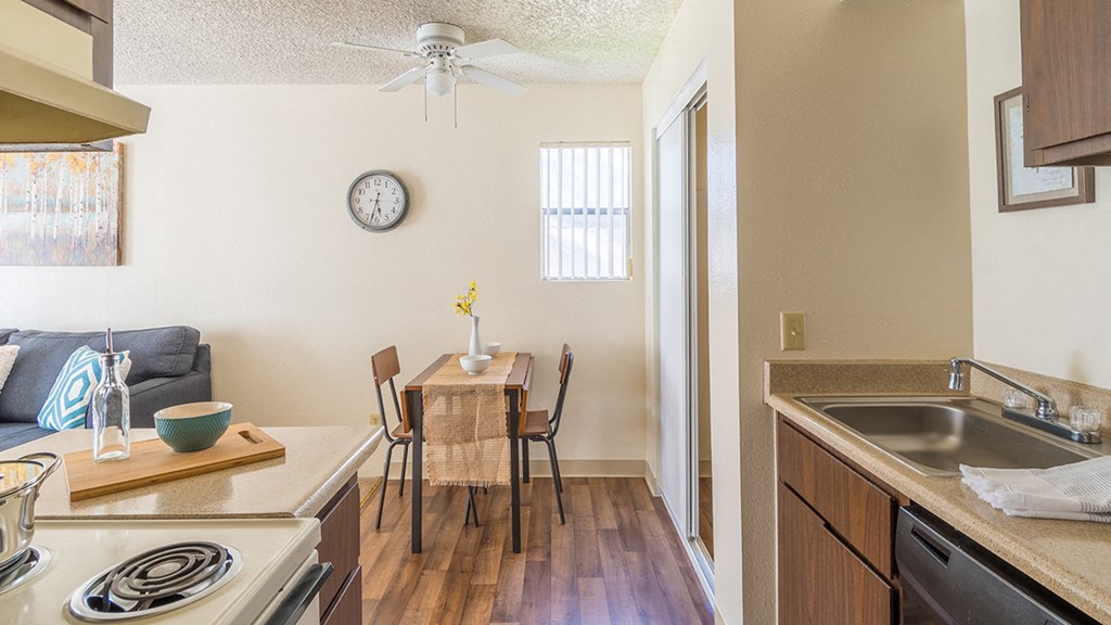 The Springs spacious kitchen with plenty of cabinetry and matching appliances with a dining area near