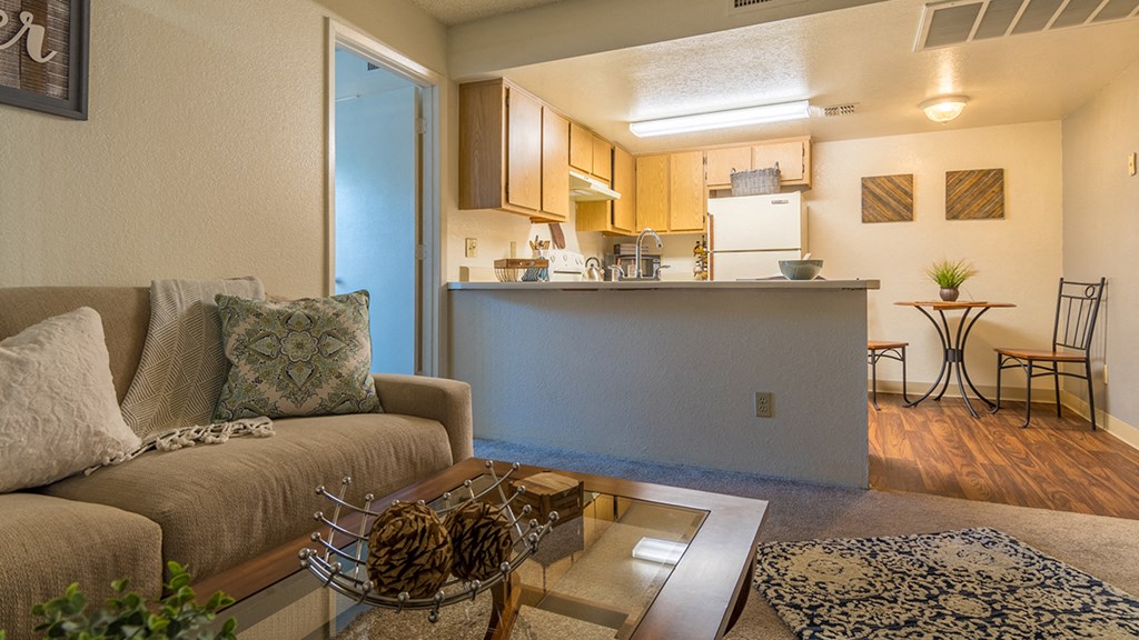 Canyon creek living room with a cozy couch and carpet flooring