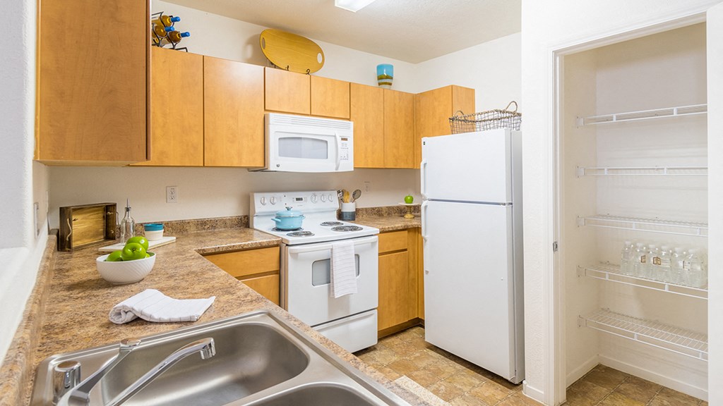 Desert Sands kitchen with all white appliances.