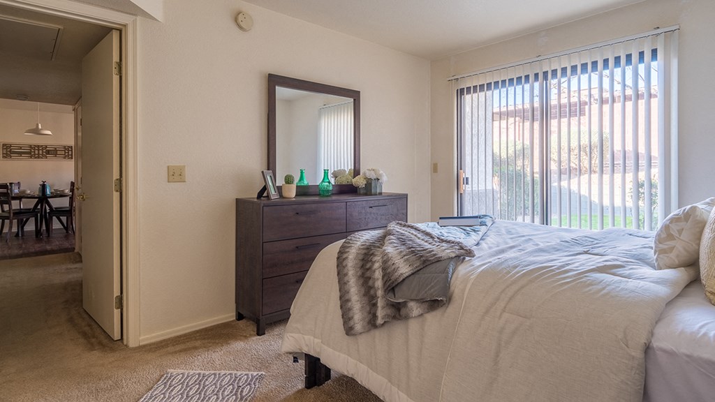 villas at Montebella bedroom with with nice natural lighting and carpet flooring