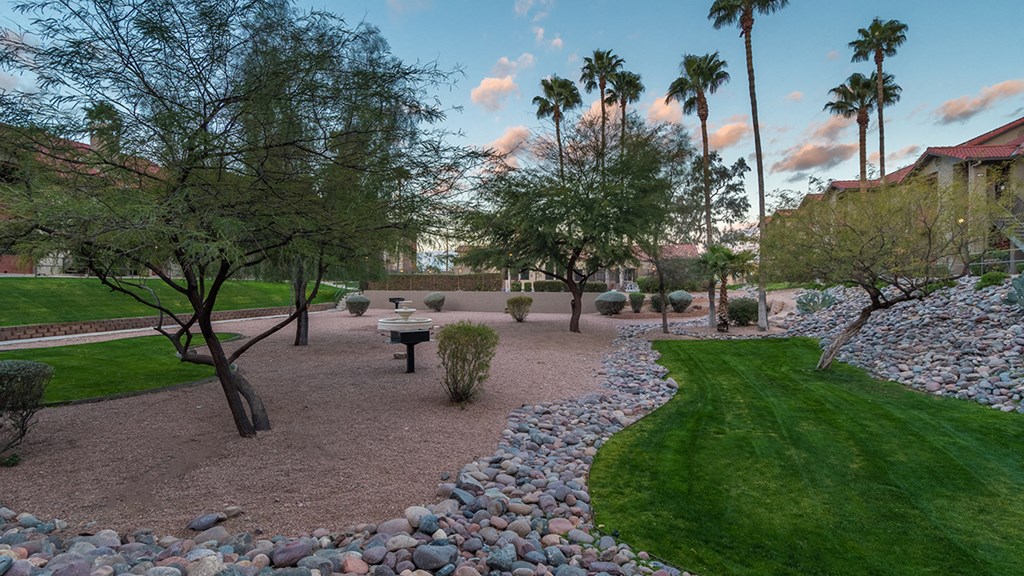 Enclave at the Foothills BBQ Area with decorative gravel and grass landscape.