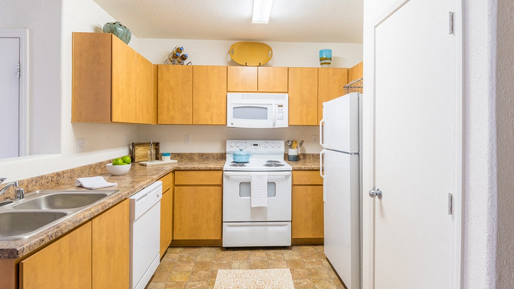 Desert Sands kitchen with all white appliances.