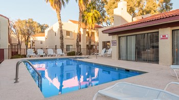Canyon creek pool view with nice relaxation area and nice tall palm trees