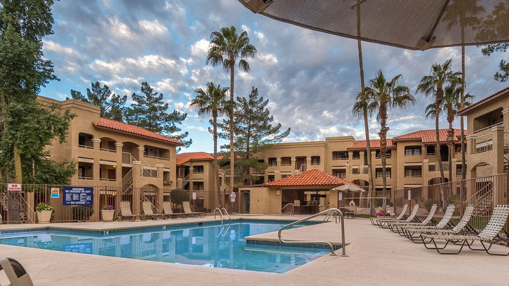 Foothills view of pool with nice lush landscape surrounding