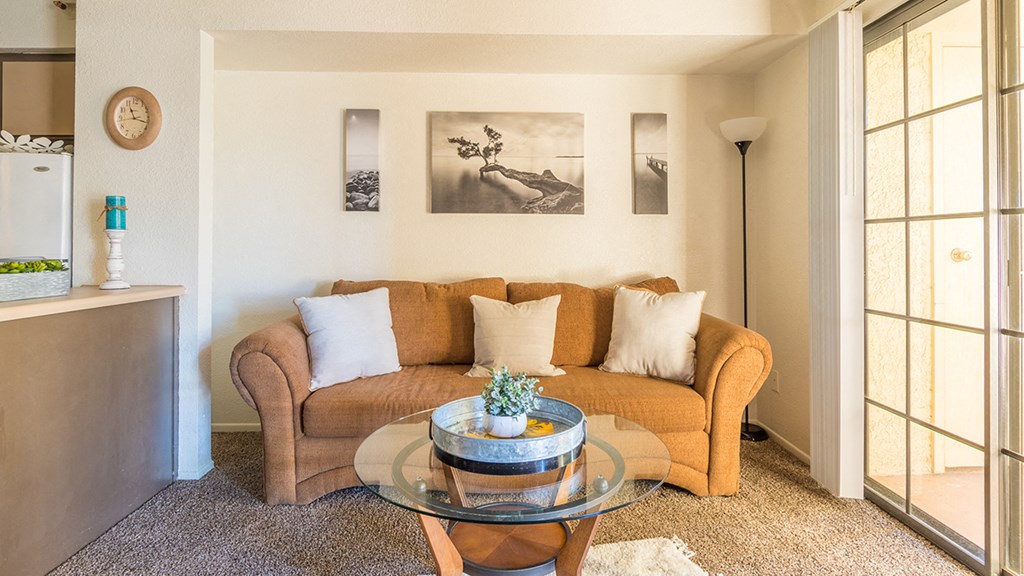 El Encanto spacious living room with sliding glass doors and plenty of natural light and private balconies