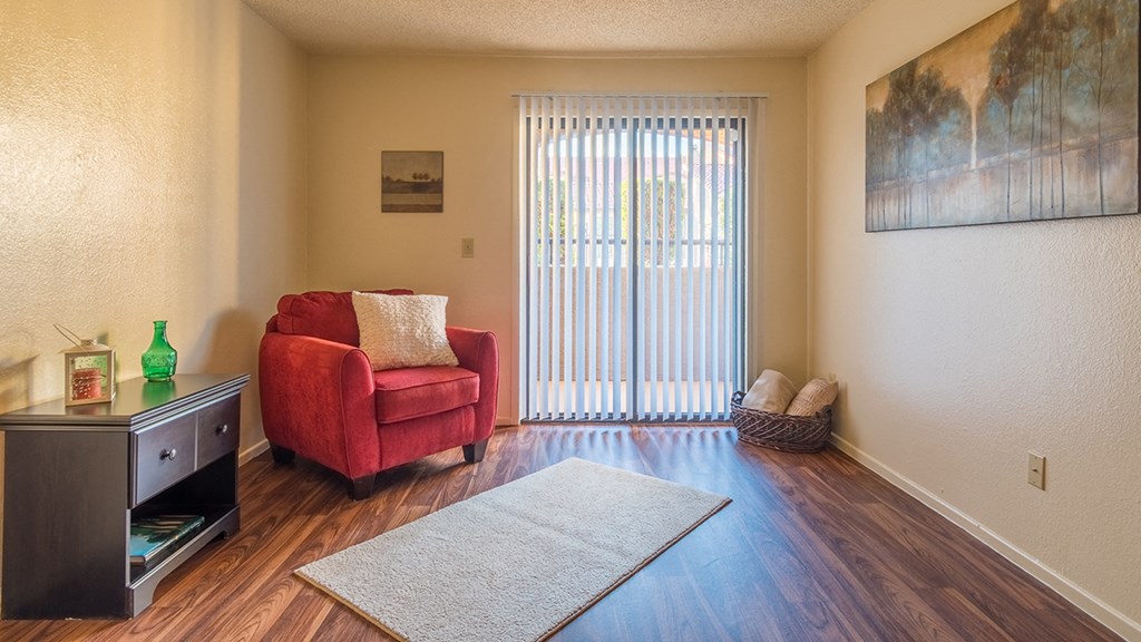 Enclave living room with glass doors and private balcony