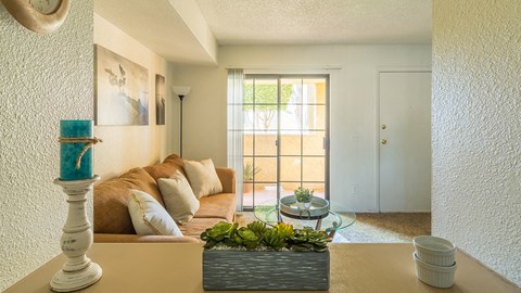 El Encanto spacious living room with sliding glass doors and plenty of natural light and private balconies