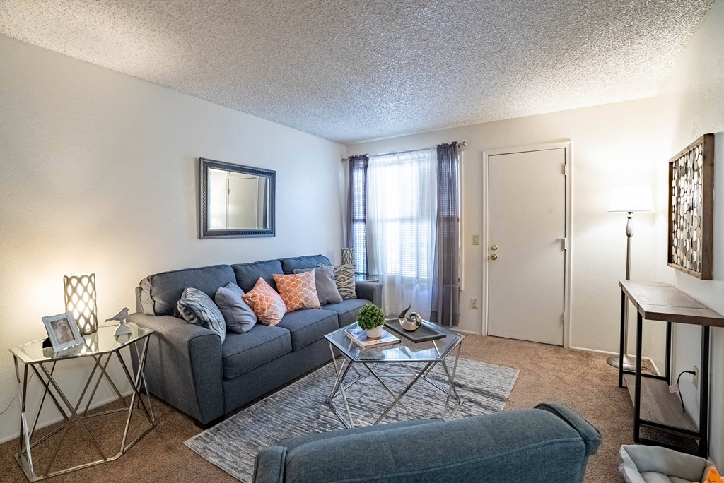 our apartments offer a living room with a couch and a coffee table