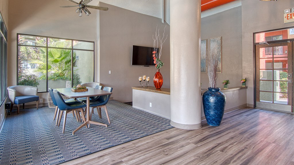 Ridgepointe clubhouse with wood flooring and sliding glass doors