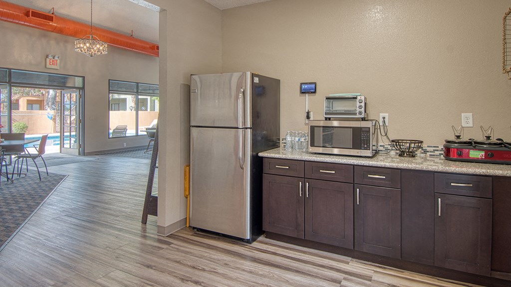 Ridgepointe clubhouse spacious kitchen with plenty of cabinetry and fridge