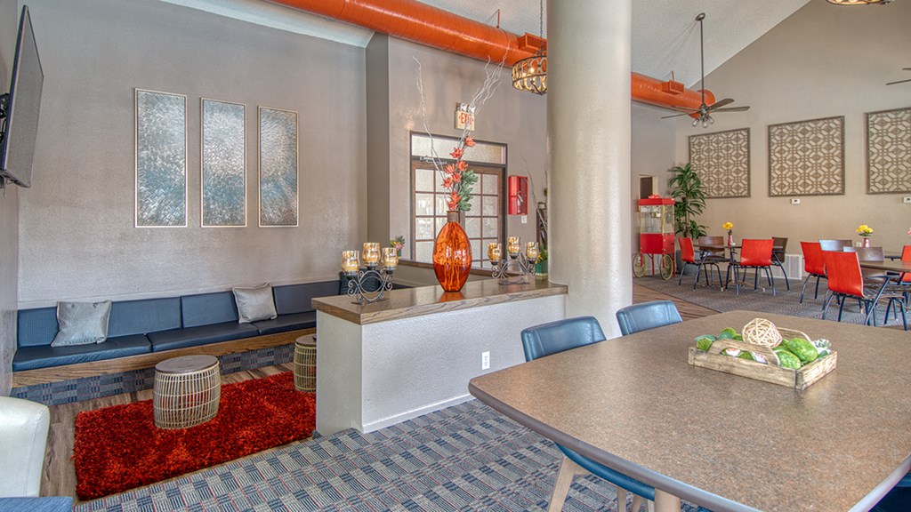 Ridgepointe clubhouse with nice lounge area and table