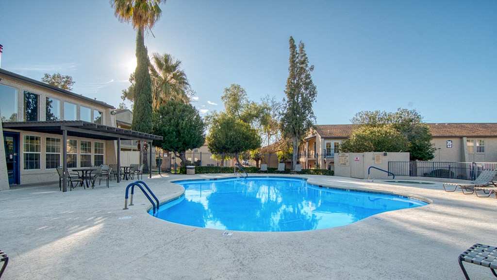 Refreshing Pool in Community with trees