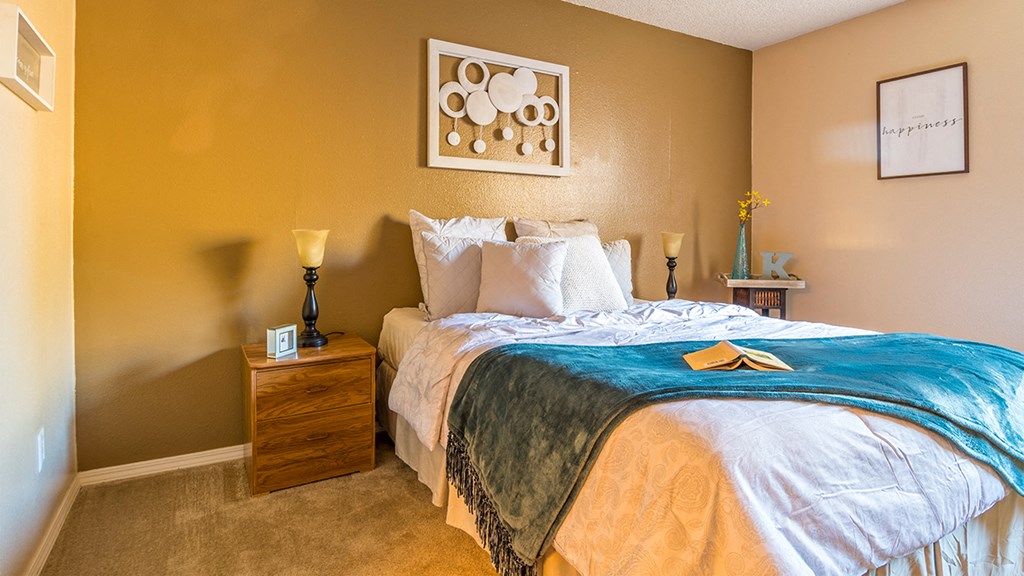 Rio Vista spacious bedroom with natural lighting and carpet flooring