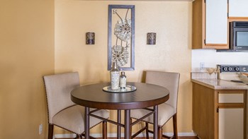 Arboretum dining area with two chairs and a round table - Photo Gallery 19