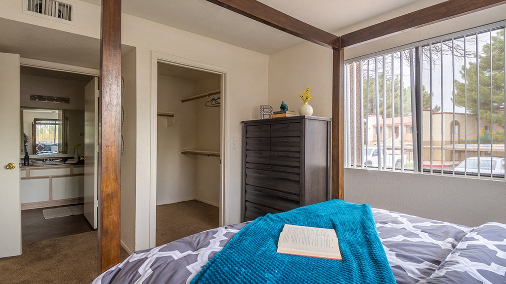 Cantera spacious master bedroom with bathrooms and nice natural lighting