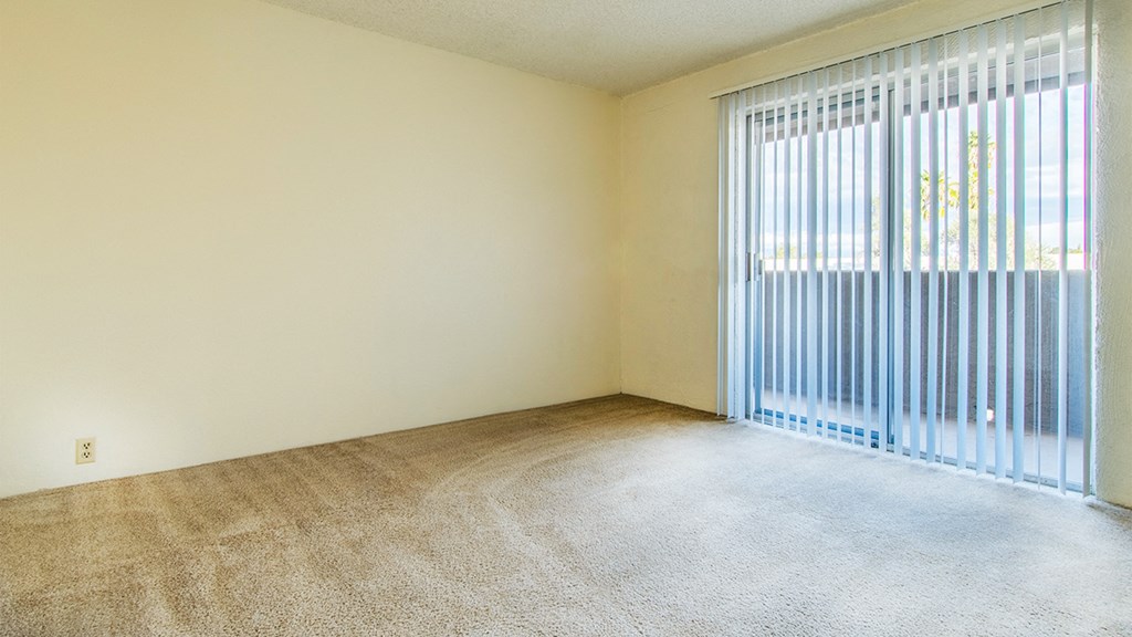 Cottonwood Creek spacious master bedroom with back sliding door.