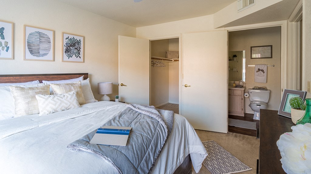 villas at Montebella bedroom with with nice natural lighting, carpet flooring and spacious closets