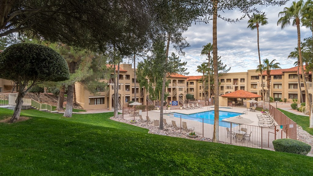 Foothills view of pool with nice lush landscape surrounding