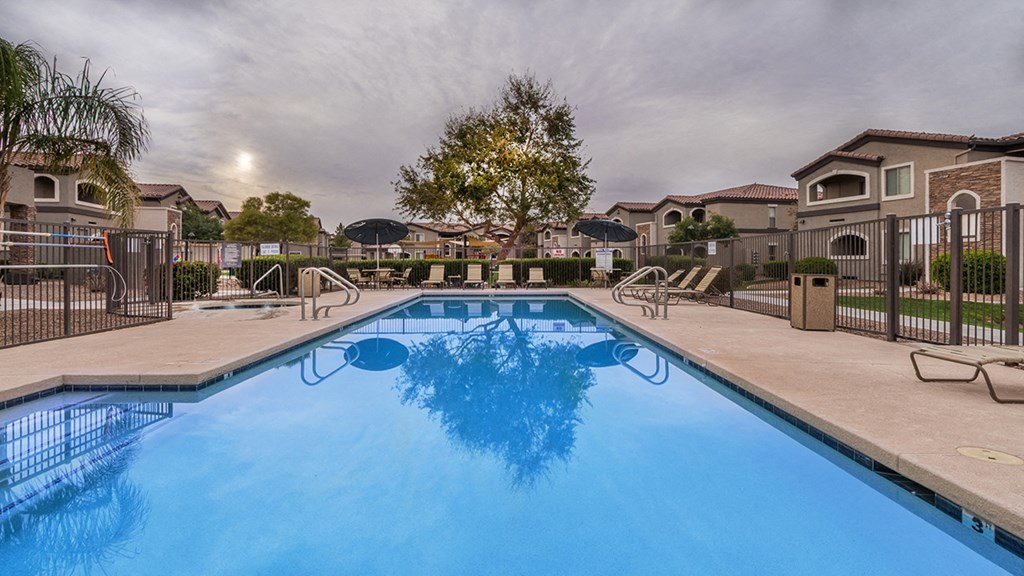 Desert Sands sparkling rectangular pool in the center of the apartment complex.