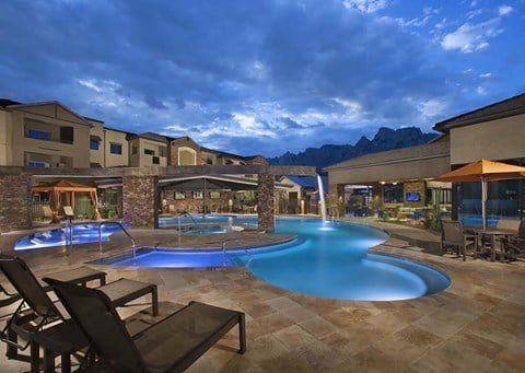 a swimming pool at the resort at night