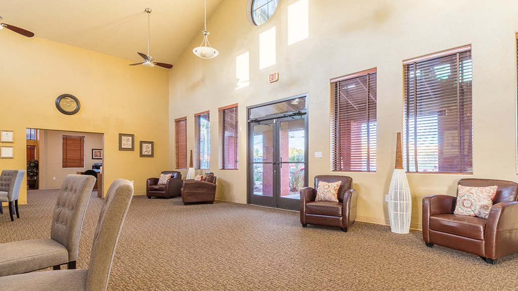 Enclave view of clubhouse with lounge area and wonderful lighting