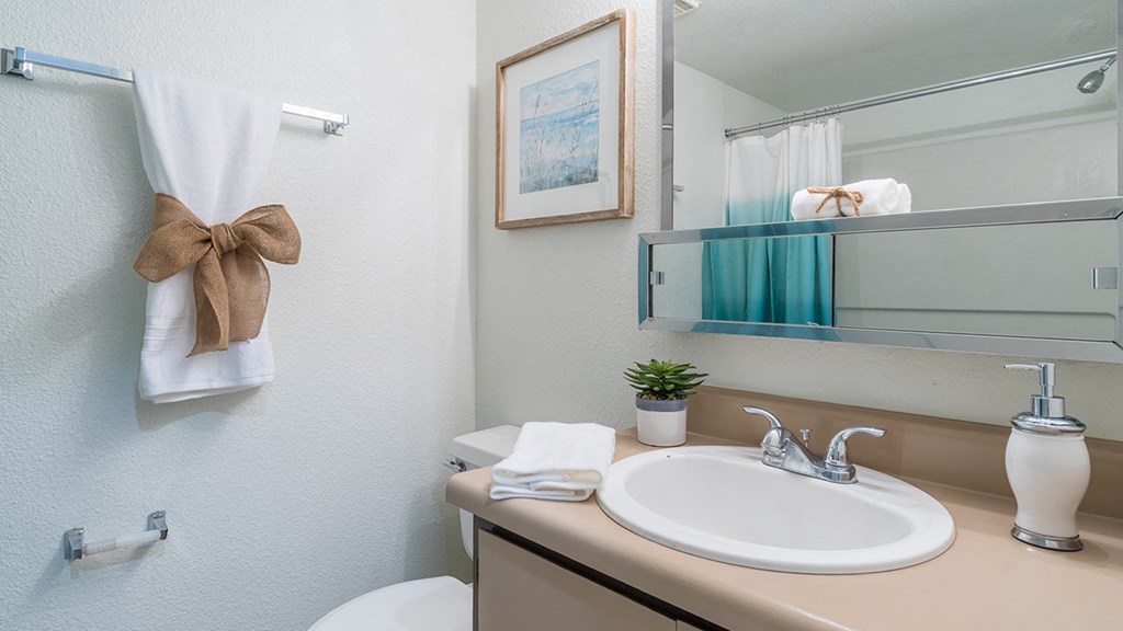 El Encanto bathroom with shower tub combo and a nice sink