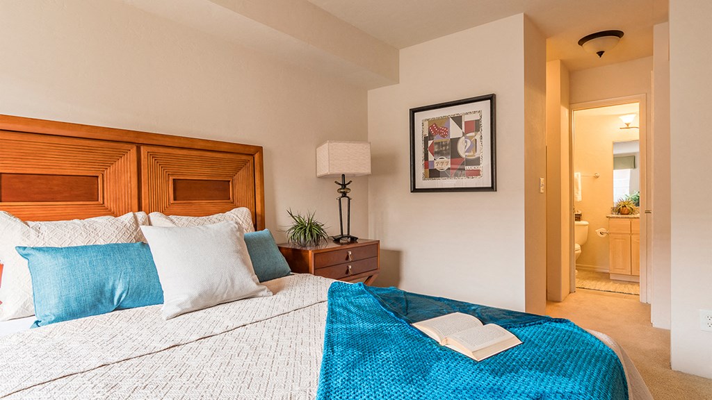 El Dorado Place bedroom with view into bathroom.