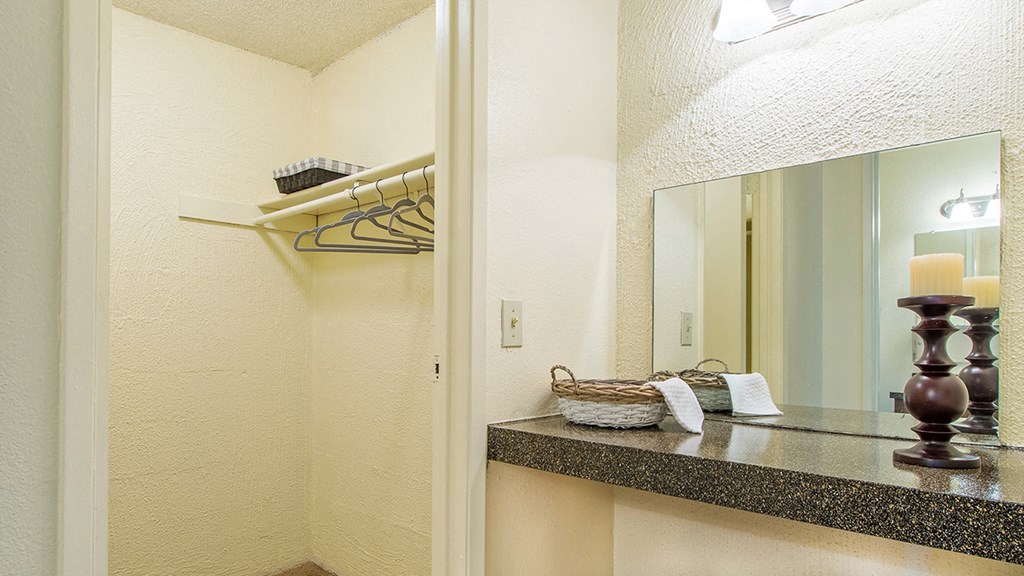 Cottonwood Creek walk in closet near a vanity space.