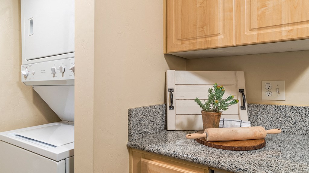 El Dorado Place laundry room with standard washer and dryer.