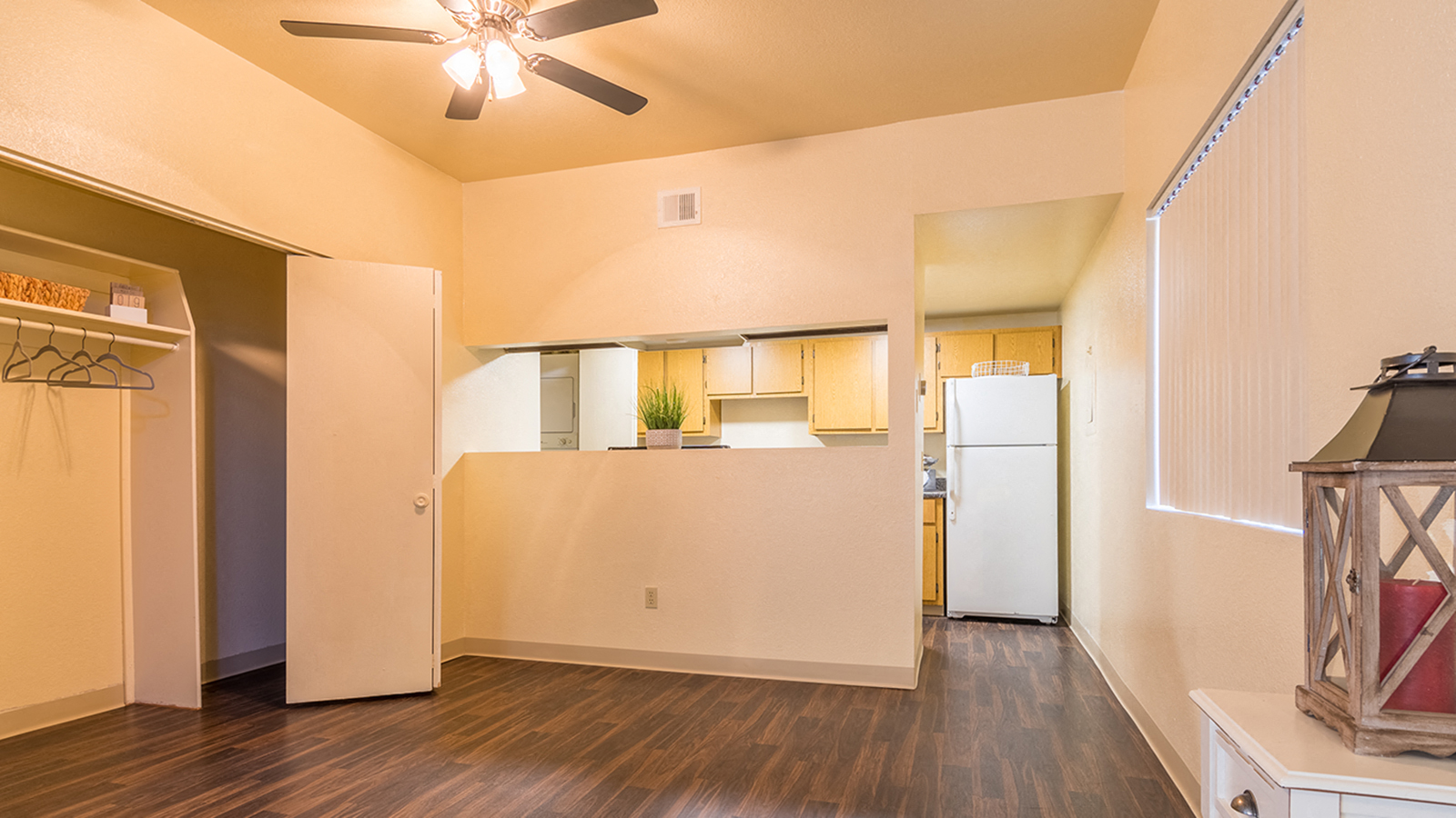 Vinyl floor dining room with closet kitchen view and bar