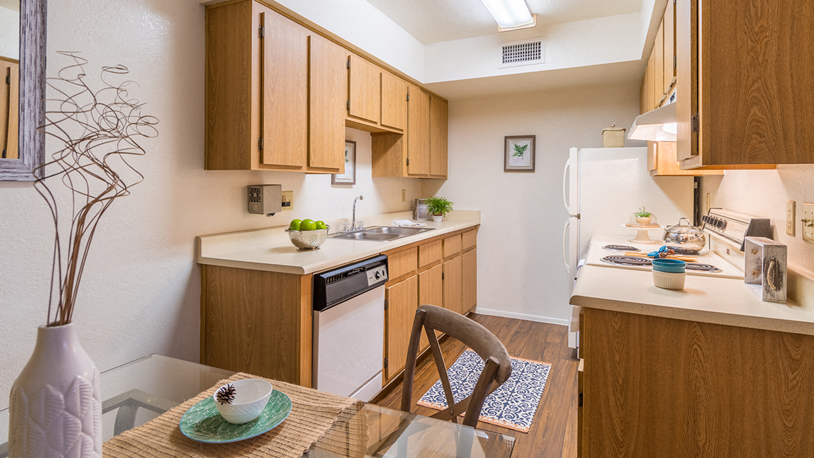 Cantera spacious kitchen with plenty of cabinetry and wood flooring