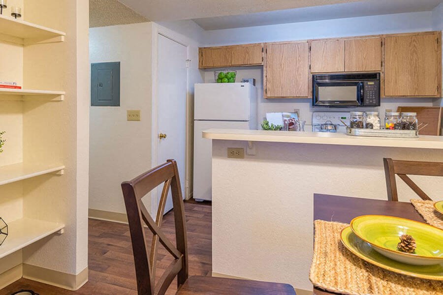 ridgepointe spacious kitchen with wood flooring and plenty of cabinetry