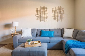 Villas at Montebella living room with nice natural lighting and carpet flooring. - Photo Gallery 4