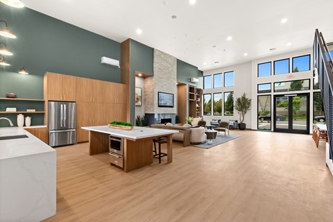A modern kitchen with a dining table and chairs.