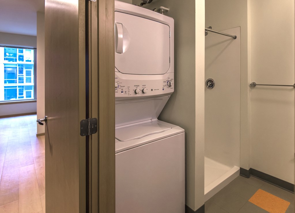 a small laundry room with a washer and dryer