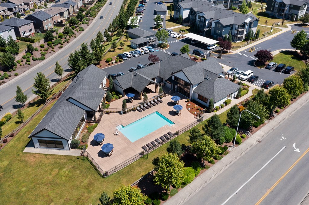 an aerial view of a house with a swimming pool