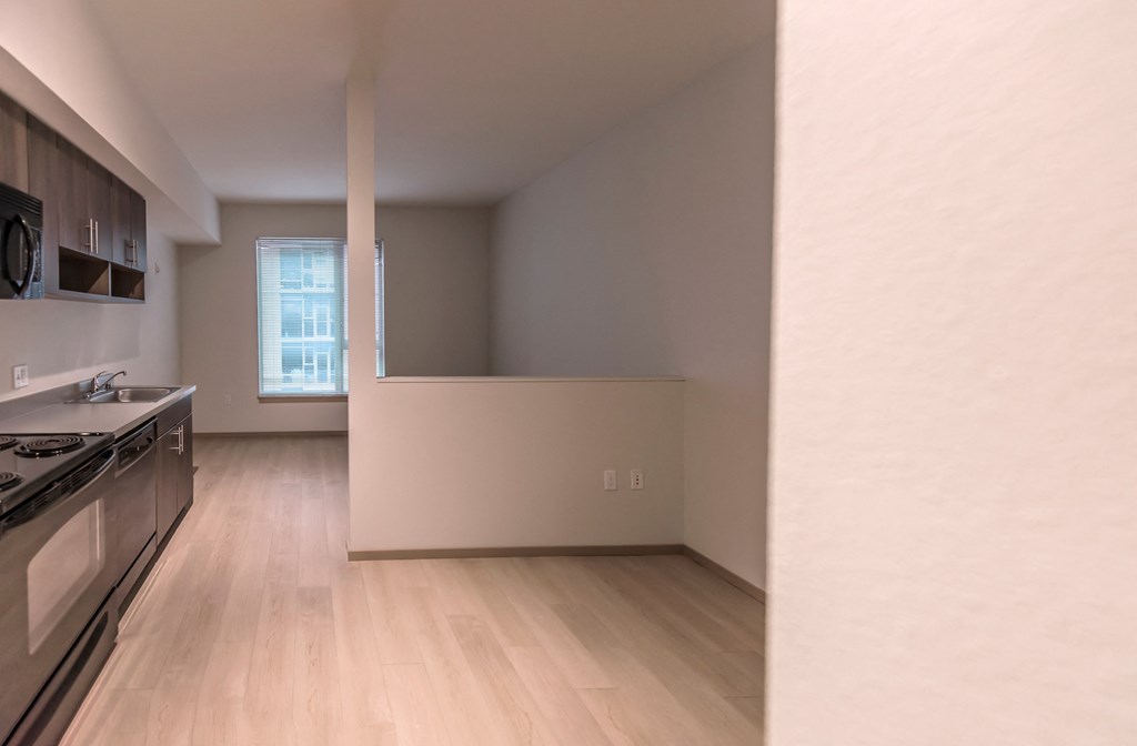an empty kitchen and living room in a house