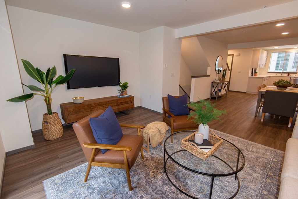 a living room with a couch and a table and a television