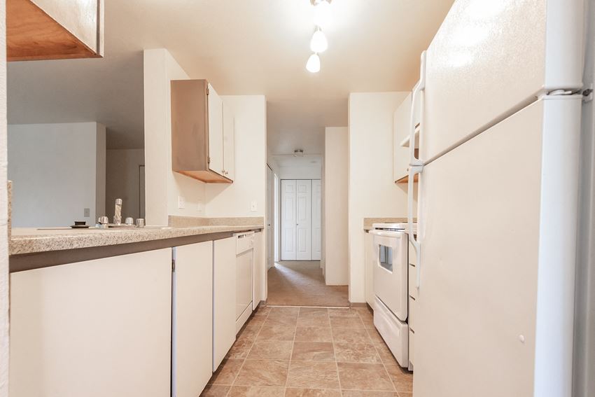 a kitchen with white cabinets and white appliances - Photo Gallery