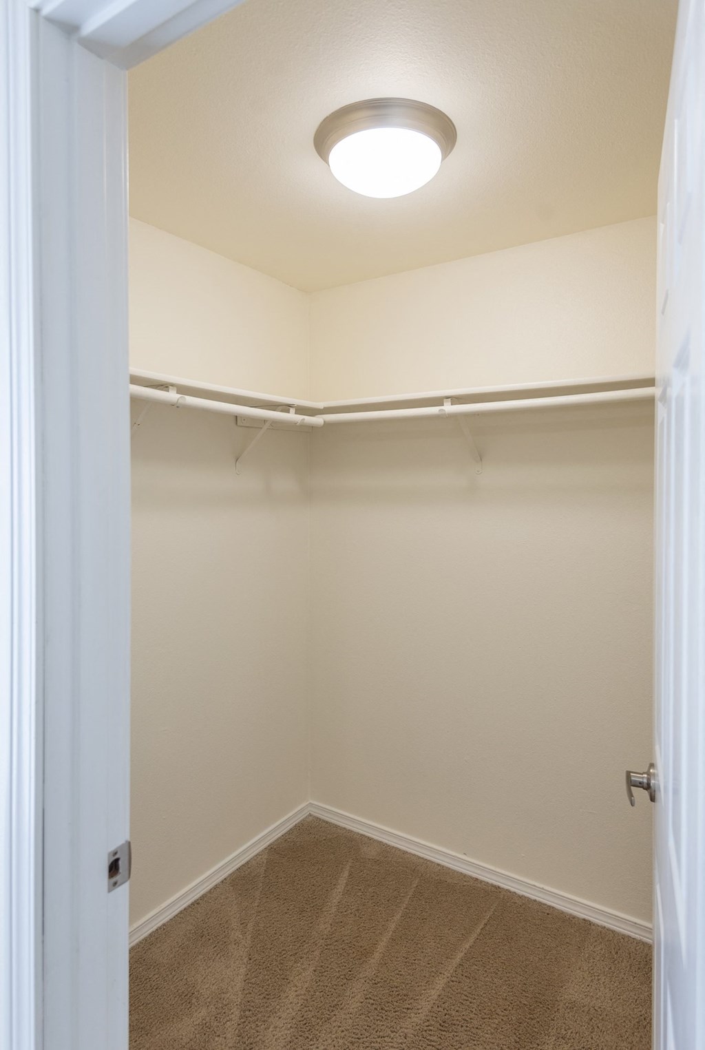 a walk in closet in a 555 waverly unit