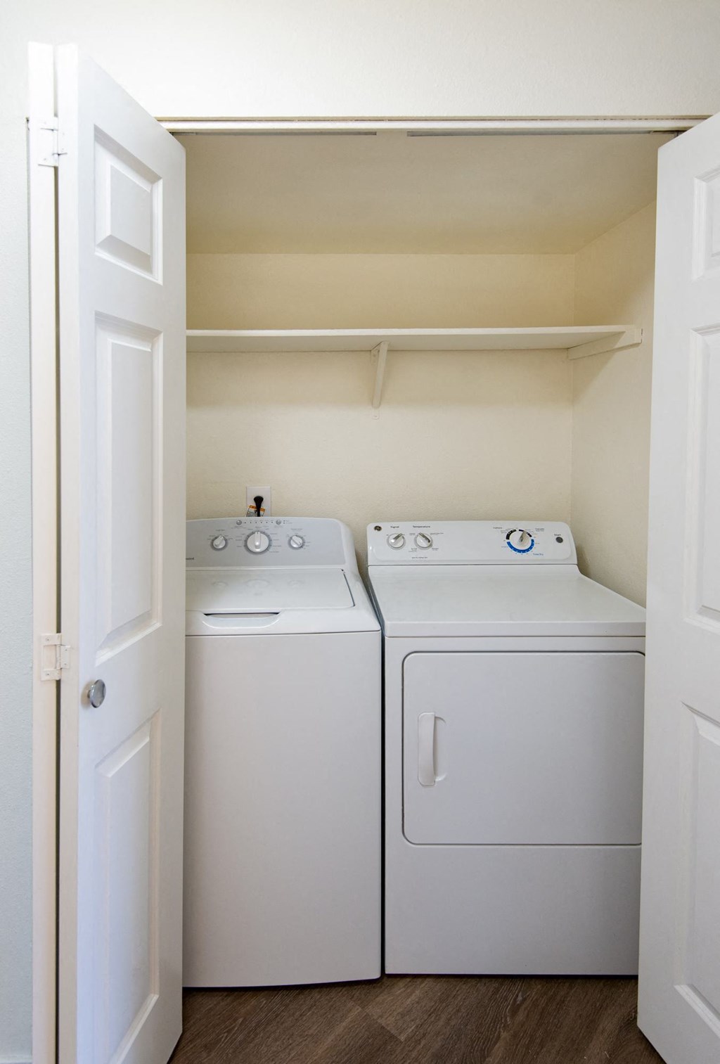 a small laundry room with a washer and dryer