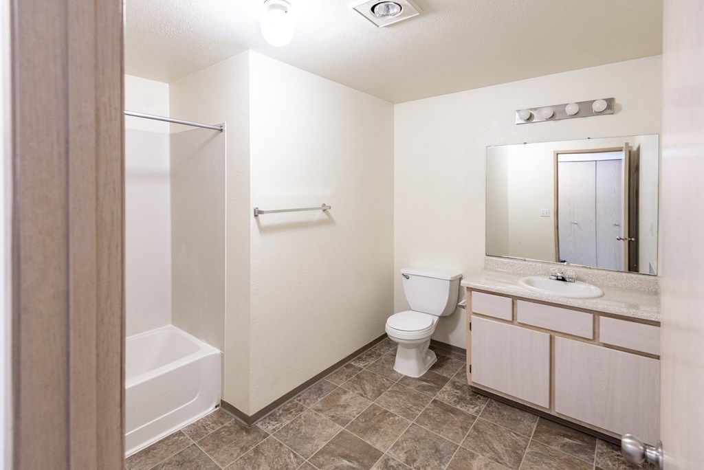 a bathroom with a toilet sink and bathtub