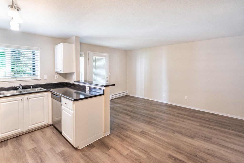 a kitchen and living room in an apartment