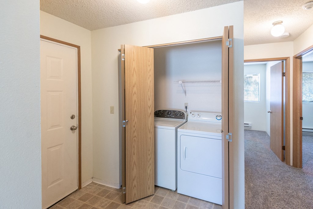 a laundry room with a washer and dryer