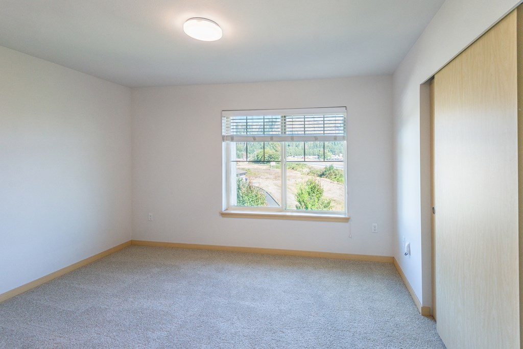 an empty room with a large window